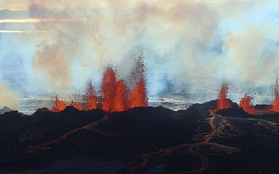 In this aerial view, fountains of lava, up to 60 meters high, spurt from a fissure in the ground on the north side of the Bardarbunga volcano in Iceland, Tuesday, September 2, 2014. (AP Photo/Stefano Di Nicolo)