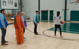 Comedian Sarah Silverman plays basketball with a priest, a rabbi, an imam, a swami and a Buddhist minister to see which religion is the greatest (Screenshot/YouTube)