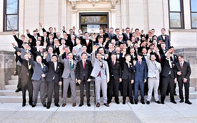 A group of high school students in Baraboo, Wisconsin, making a salute in a photo published on November 11, 2018. At back right is Jordan Blue, who didn't salute. (Screenshot: Twitter)