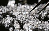 Illustration of diamonds being picked by  jewelry maker in Jerusalem, July 21, 2008. (Nati Shohat/Flash90)