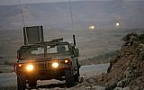 Illustrative: An Israeli military jeep patrols along the border with Egypt on March 29, 2005. (Moshe Shai/FLASH90)