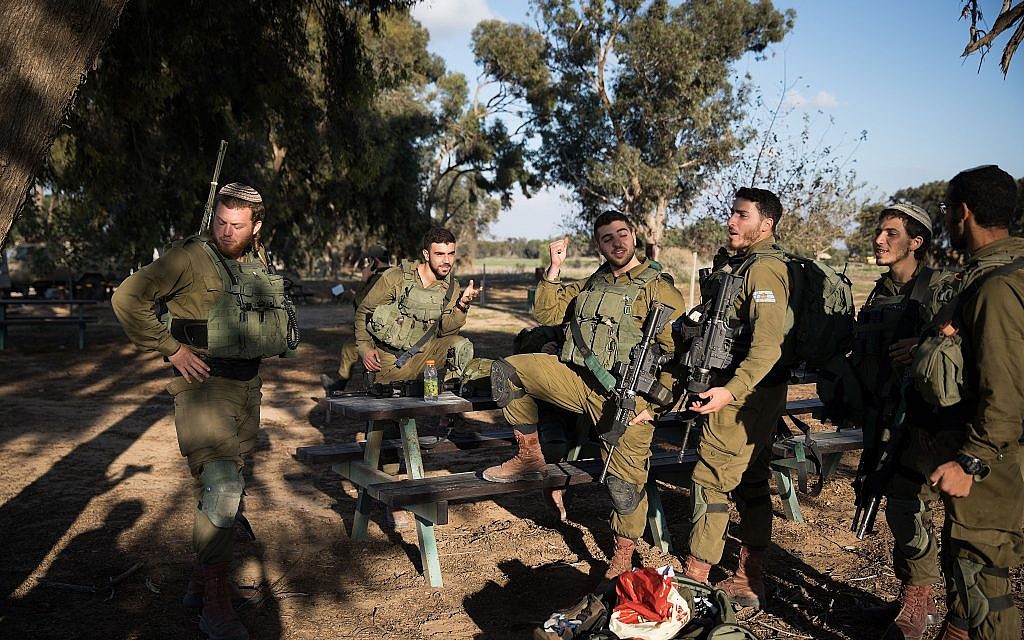 IDF soldiers rest close to Kibbutz Nir Oz, in southern Israel near the border with Gaza, on November 12, 2018. (Hadas Parush/Flash90)