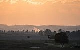 Illustrative: Smoke rises from a fallen rocket fired from Gaza in a field in southern Israel near the border with Gaza on November 13, 2018. (Hadas Parush/Flash90)