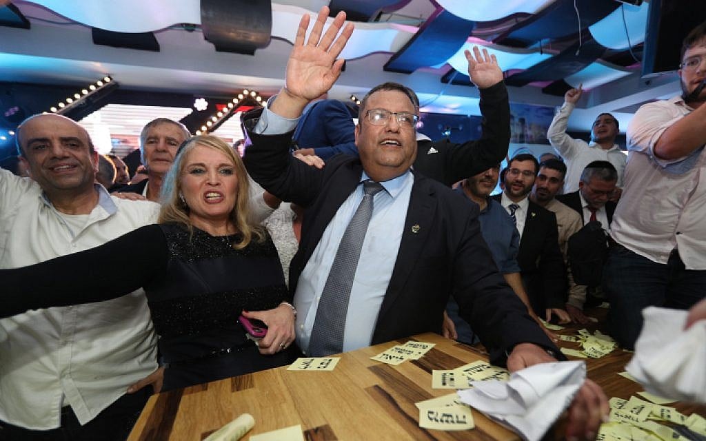 Supporters of Jerusalem mayoral candidate Moshe Lion (center) react as the preliminary results of the mayoral race are announced, November 13, 2018. (Yonatan Sindel/FLASH90)