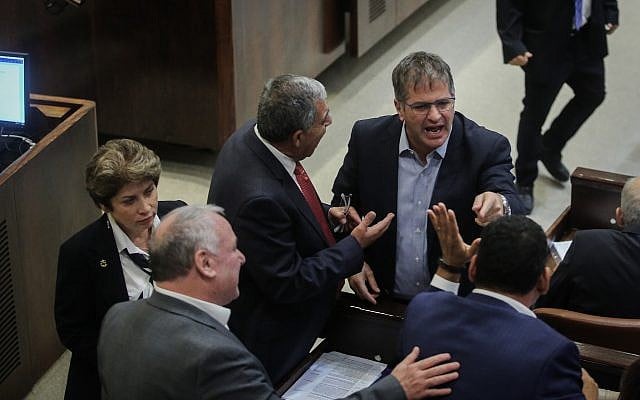 A scuffle between Knesset members, at a plenum session at the Israeli parliament on November 19, 2018. (Hadas Parush/Flash90) A scuffle between Knesset members, at a plenum session at the Israeli parliament on November 19, 2018. (Hadas Parush/Flash90)