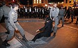 Ultra-Orthodox Jews clash with police as they protest the army draft in Jerusalem, November 28, 2018. (Noam Revkin Fenton/Flash90)