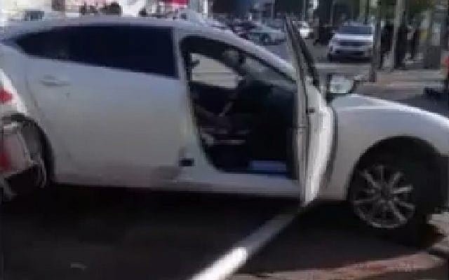 Screen capture from video showing the scene of a suspected crime gang shooting in the city of Holon, November 19, 2018. (Hadashot News) Screen capture from video showing the scene of a suspected crime gang shooting in the city of Holon, November 19, 2018. (Hadashot News)