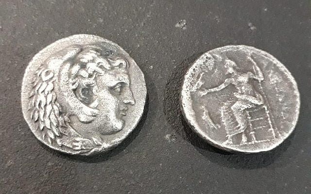 Two coins imprinted between 323 and 325 BCE, during the last years of Alexander the Great's reign, found in a smuggler's luggage at the Erez Crossing on the Israel-Gaza border on November 7, 2018. (Courtesy Defense Ministry/COGAT)