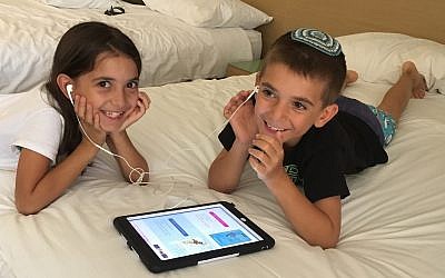 Children listening to books published by the Israel Audiobook Project (Courtesy)