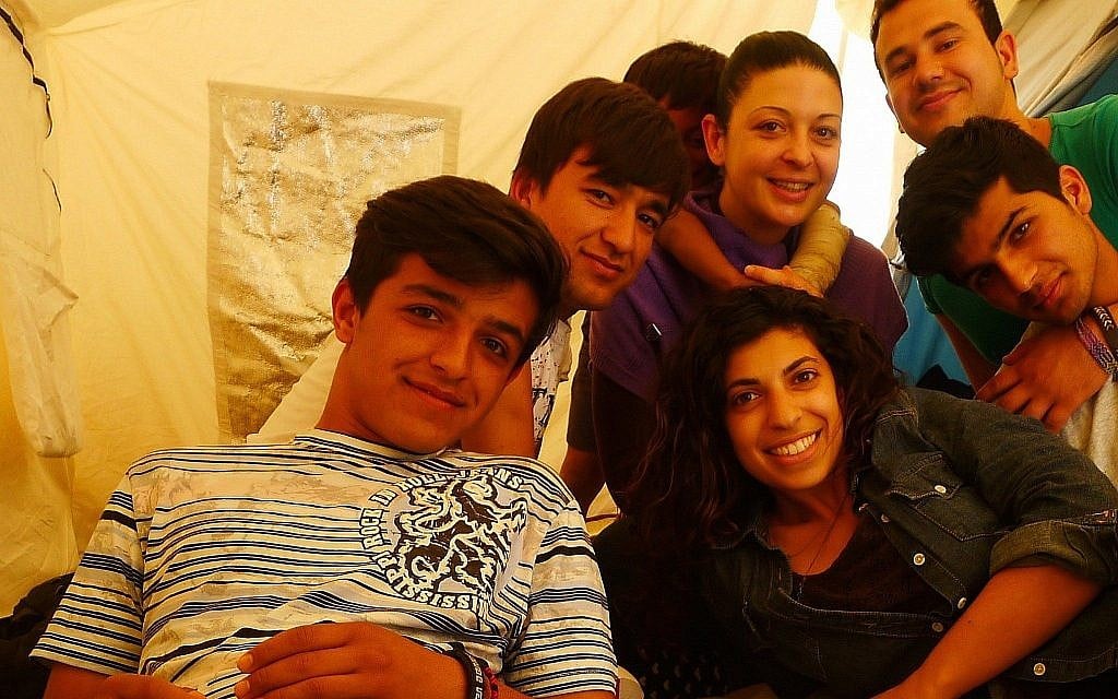 Hadas Yanay with some of the Afghan refugees she worked with in Greece before coming to HIAS. (Courtesy/ Hadas Yanay)