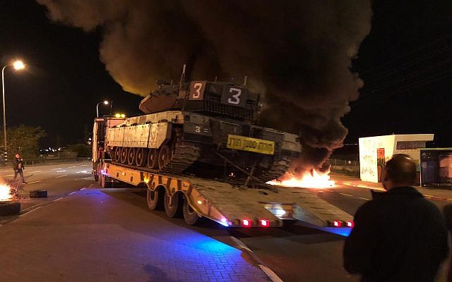 Burning tires are seen on Route 34 at the entrance to the southern Israeli town of Sderot on November 14, 2018, during a protest over the government's handling of violence from the Gaza Strip. (Israel Police) Burning tires are seen on Route 34 at the entrance to the southern Israeli town of Sderot on November 14, 2018, during a protest over the government's handling of violence from the Gaza Strip. (Israel Police)