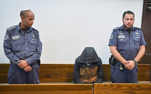 Eritrean national Tesfebarhan Tesfasion arrives for a court hearing at the Tel Aviv Magistrate's Court on November 29, 2018. (Flash90) Eritrean national Tesfebarhan Tesfasion arrives for a court hearing at the Tel Aviv Magistrate's Court on November 29, 2018. (Flash90)