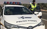 Illustrative: A police officer giving a ticket in the West Bank. (Israel Police)