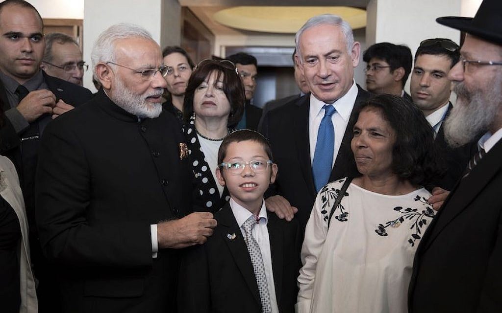 Indian Prime Minister Narendra Modi, left, and Israeli Prime Minister Benjamin Netanyahu meet with Moshe Holtzberg and his nanny Sandra Samuel in Kfar Chabad, Israel on July 5, 2017. (Atef Safadi/AFP/Getty Images/via JTA) Indian Prime Minister Narendra Modi, left, and Israeli Prime Minister Benjamin Netanyahu meet with Moshe Holtzberg and his nanny Sandra Samuel in Kfar Chabad, Israel on July 5, 2017. (Atef Safadi/AFP/Getty Images/via JTA)