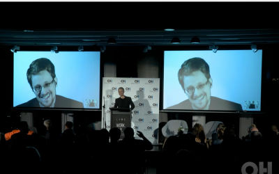 Edward Snowden speaks to journalists and invited guests at a Tel Aviv event produced by the Orenstein Hoshen PR agency (Courtesy)
