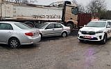 Cars damaged in East Jerusalem alongside a truck graffitied with the words 'No more Arab terrorism,' November 23, 2018 (Israel Police spokesperson)