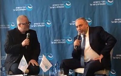 Former defense minister Avigdor Liberman right) addressing a conference in Netanya, November 22, 2018. (Screenshot)