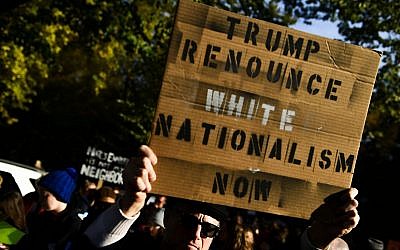 Protesters demonstrate against US President Donald Trump near the Tree of Life synagogue in Pittsburgh as he visited the site where 11 Jewish worshippers were killed, on October 30, 2018. (Brendan Smialowski/AFP/Getty Images via JTA)