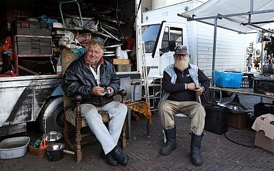 Vendors take a break in Amsterdam’s Waterloo Square Market, October 25, 2017. (Huub Zeeman/Flickr/via JTA)