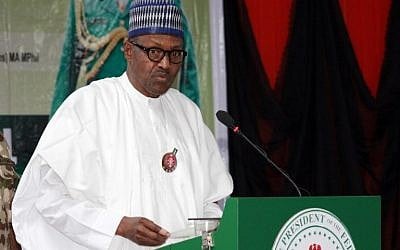 Nigerian president Muhammadu Buhari delivers a speech during the opening ceremony of the military staff annual conference, on November 28, 2018, as part of his trip to visit troops on front lines of Boko Haram conflict. (Photo by Audu MARTE / AFP)
