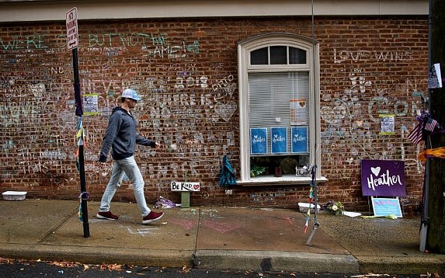 In this file photo taken on November 26, 2018, a man walks past a memorial to Heather Heyer and the other victims of last year's hit and run a few blocks away the first day of jury selection for James Fields's murder trial at the Charlottesville Circuit Court, in Charlottesville, Virginia. (Brendan Smialowski / AFP) In this file photo taken on November 26, 2018, a man walks past a memorial to Heather Heyer and the other victims of last year's hit and run a few blocks away the first day of jury selection for James Fields's murder trial at the Charlottesville Circuit Court, in Charlottesville, Virginia. (Brendan Smialowski / AFP)