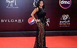 Egyptian actress Rania Youssef poses on the red carpet at the closing ceremony of the 40th edition of the Cairo International Film Festival (CIFF) at the Cairo Opera House in the Egyptian capital on November 29, 2018. (Suhail SALEH / AFP)