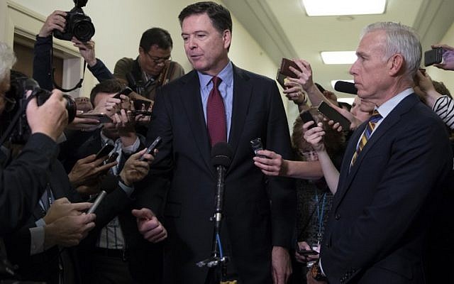 Former FBI Director James Comey (C) talks to reporters following a closed House Judiciary Committee meeting to hear his testimony, on Capitol Hill in Washington, DC, on December 7, 2018. (Alex Edelman / AFP) Former FBI Director James Comey (C) talks to reporters following a closed House Judiciary Committee meeting to hear his testimony, on Capitol Hill in Washington, DC, on December 7, 2018. (Alex Edelman / AFP)