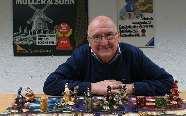 Tom Werneck poses behind a board game at the Bayerisches Spielearchiv archive for board games in Munich, southern Germany, on December 12, 2018 (Christof STACHE / AFP) Tom Werneck poses behind a board game at the Bayerisches Spielearchiv archive for board games in Munich, southern Germany, on December 12, 2018 (Christof STACHE / AFP)