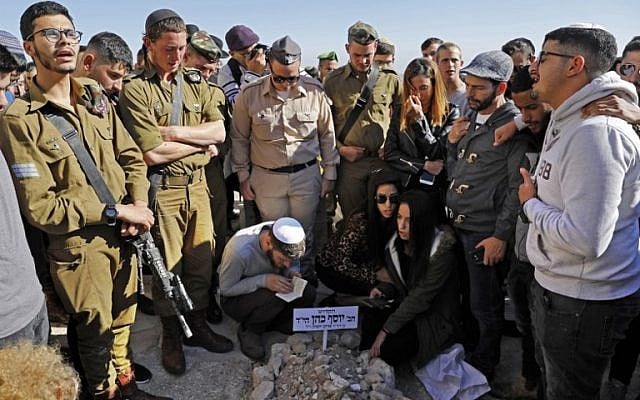 Friends and relatives of Sgt. Yosef Cohen mourn during his funeral in Jerusalem on December 14, 2018, a day after he was killed in a West Bank terror shooting. (Ahmad Gharabli/AFP) Friends and relatives of Sgt. Yosef Cohen mourn during his funeral in Jerusalem on December 14, 2018, a day after he was killed in a West Bank terror shooting. (Ahmad Gharabli/AFP)