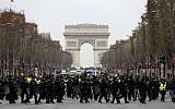 French riot police take position in front of "yellow vest" protesters on the Champs-Elysees in Paris, on December 15, 2018. (Valery Hache/AFP)