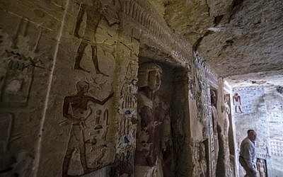 Mostafa Waziri, Secretary General of Egypt's Supreme Council of Antiquities, walks in a newly-discovered tomb at the Saqqara necropolis, 30 kilometres south of the Egyptian capital Cairo, on December 15, 2018, belonging to the high priest "Wahtye" who served during the fifth dynasty reign of King Neferirkare (between 2500-2300 BC).  (Khaled DESOUKI / AFP)