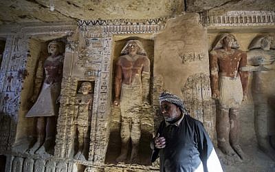 Said Abdel Aal, an Egyptian archaelogical labourer, stands in a newly-discovered tomb at the Saqqara necropolis, 30 kilometres south of the Egyptian capital Cairo, on December 15, 2018, belonging to the high priest "Wahtye" who served during the fifth dynasty reign of King Neferirkare. (Khaled DESOUKI / AFP)