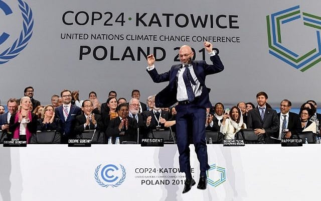 COP24 president Michal Kurtyka jumps at the end of the final session of the COP24 summit on climate change in Katowice, southern Poland, on December 15, 2018. (Janek SKARZYNSKI / AFP) COP24 president Michal Kurtyka jumps at the end of the final session of the COP24 summit on climate change in Katowice, southern Poland, on December 15, 2018. (Janek SKARZYNSKI / AFP)