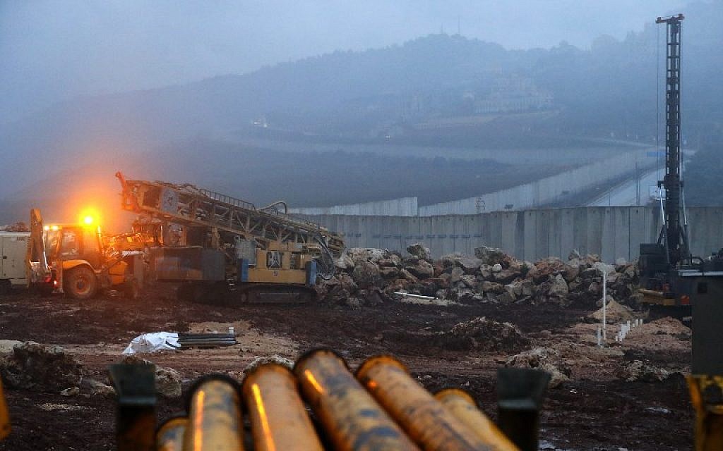 A picture taken on December 19, 2018 shows a view of Israeli excavation equipment at work near the concrete barrier along the border with Lebanon, near the northern Israeli town of Metula. (JACK GUEZ / AFP)