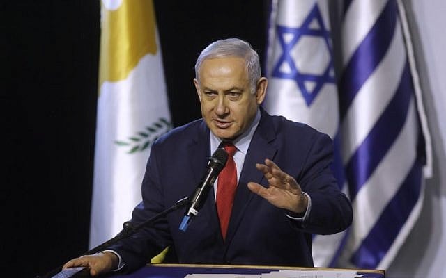 Prime Minister Benjamin Netanyahu delivers a speech during the 5th Israel-Greece-Cyprus summit, before the signing a trilateral agreements in cyber and innovation, on December 20, 2018 in Beersheba. (Menahem KAHANA / AFP) Prime Minister Benjamin Netanyahu delivers a speech during the 5th Israel-Greece-Cyprus summit, before the signing a trilateral agreements in cyber and innovation, on December 20, 2018 in Beersheba. (Menahem KAHANA / AFP)