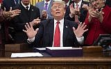 US President Donald Trump receives applause after signing the "First Step Act" and the "Juvenile Justice Reform Act" at the White House in Washington, DC, on December 21, 2018. (Jim WATSON / AFP)