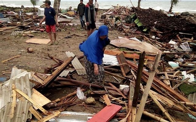 Residents inspect the damage to their homes on Carita beach in Indonesia on December 23, 2018, after the area was hit by a tsunami on December 22 that may have been caused by the Anak Krakatoa volcano. (Photo by Semi/AFP) Residents inspect the damage to their homes on Carita beach in Indonesia on December 23, 2018, after the area was hit by a tsunami on December 22 that may have been caused by the Anak Krakatoa volcano. (Photo by Semi/AFP)