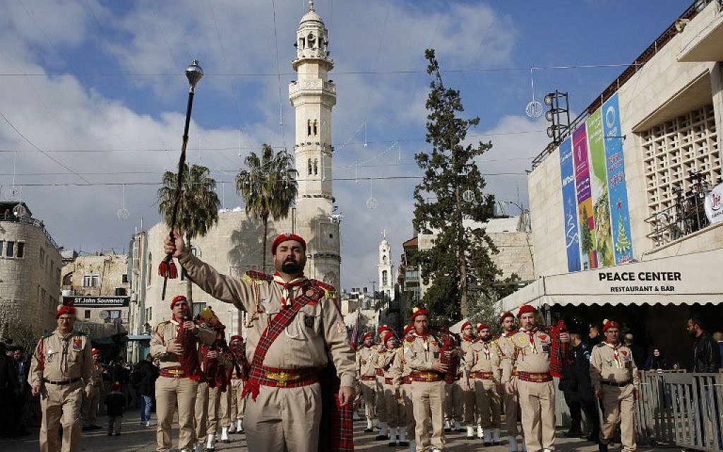 A Palestinian band performs on Manger square in front of the Church of the Nativity in the biblical West Bank city of Bethlehem, on December 24, 2018. (HAZEM BADER/AFP)