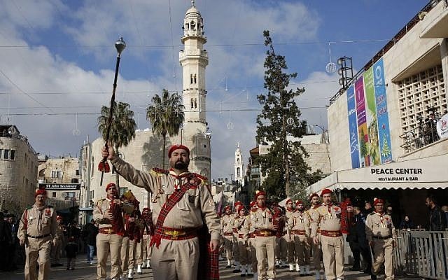 A Palestinian band performs on Manger square in front of the Church of the Nativity in the biblical West Bank city of Bethlehem, on December 24, 2018. (HAZEM BADER/AFP) A Palestinian band performs on Manger square in front of the Church of the Nativity in the biblical West Bank city of Bethlehem, on December 24, 2018. (HAZEM BADER/AFP)