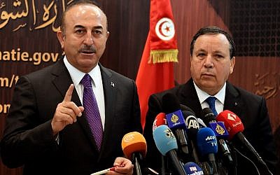 Turkish Foreign Minister Mevlut Cavusoglu,left, attends a press conference with Tunisian Foreign Affairs Minister Khemaies Jhinaoui, in Tunis, Tunisia, on December 24, 2018. (FETHI BELAID/AFP)