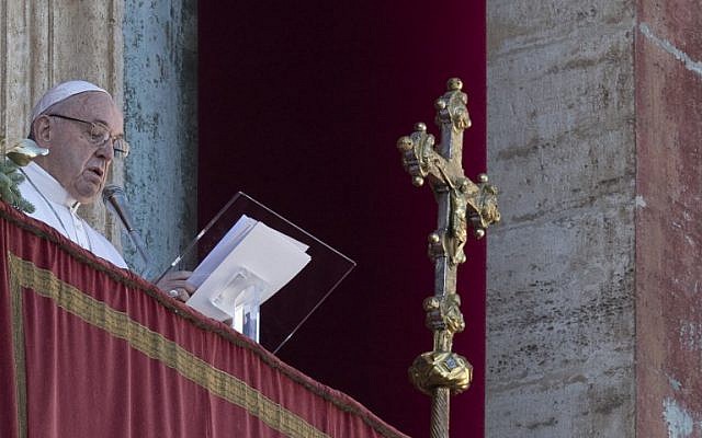 Pope Francis delivers a speech from the balcony of St. Peter's basilica during the traditional "Urbi et Orbi" Christmas message to the city and the world, on December 25, 2018 at St. Peter's square in Vatican. (Photo by Tiziana FABI / AFP) Pope Francis delivers a speech from the balcony of St. Peter's basilica during the traditional "Urbi et Orbi" Christmas message to the city and the world, on December 25, 2018 at St. Peter's square in Vatican. (Photo by Tiziana FABI / AFP)