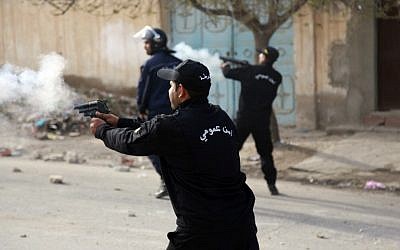 Tunisian police fire tear gas toward protesters during a demonstration on December 25, 2018, in the central Tunisian city of Kasserine. (Hatem Salhi/AFP)