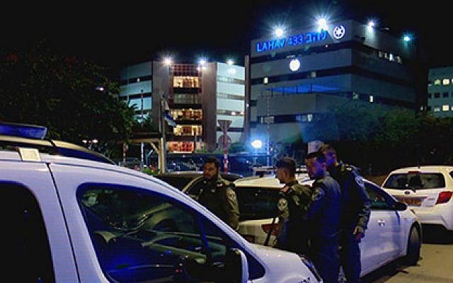 Police at the scene of a shooting in Lod, outside police's national fraud unit (Hadashot TV news screenshot) Police at the scene of a shooting in Lod, outside police's national fraud unit (Hadashot TV news screenshot)