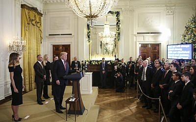US President Donald Trump speaks at a Hanukkah reception in the East Room of the White House, December 6, 2018. (Oliver Contreras/Pool/Getty Images via JTA)