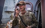 Vice Adm. Scott Stearney speaks on the shipboard intercom to welcome the crew of the guided-missile destroyer USS Jason Dunham to Manama, Bahrain, on October 24, 2018. (US Navy/ Jonathan Clay)