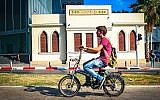 A man rides an electric bicycle in Tel Aviv on July 5, 2016. (Flickr/Ted Eytan/CC BY-SA)