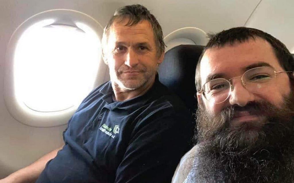 Rabbi Zalmen Wishedski, right, wrote a Facebook post about his conversation with a German man who travels to Israel to renovate Holocaust survivors’ apartments. (Wishedski/via JTA)