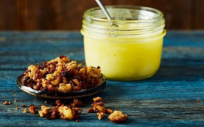 Rendered chicken fat is distinctly yellow. The gribenes, or cracklings, are delicious little morsels of crisped skin. (The Fat Kitchen © by Andrea Chesman. Photography/ © by Keller + Keller Photography/ Storey Publishing)