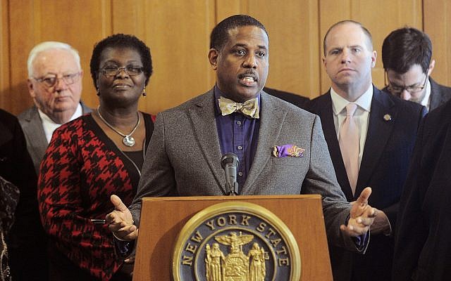 In this February 6, 2017, file photo, state Sen. Kevin Parker, a Democrat from Brooklyn, stands at the podium flanked by Senate members during a news conference at the Capitol in Albany, New York. (AP Photo/Hans Pennink, File) In this February 6, 2017, file photo, state Sen. Kevin Parker, a Democrat from Brooklyn, stands at the podium flanked by Senate members during a news conference at the Capitol in Albany, New York. (AP Photo/Hans Pennink, File)