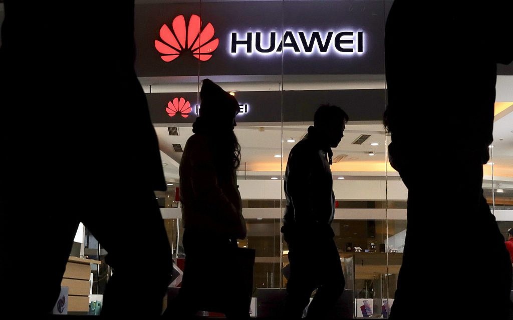 Pedestrians walk past a Huawei retail shop in Beijing Thursday, Dec. 6, 2018. China on Thursday demanded Canada release a Huawei Technologies executive who was arrested in a case that adds to technology tensions with Washington and threatens to complicate trade talks. (AP Photo/Ng Han Guan) Pedestrians walk past a Huawei retail shop in Beijing Thursday, Dec. 6, 2018. China on Thursday demanded Canada release a Huawei Technologies executive who was arrested in a case that adds to technology tensions with Washington and threatens to complicate trade talks. (AP Photo/Ng Han Guan)